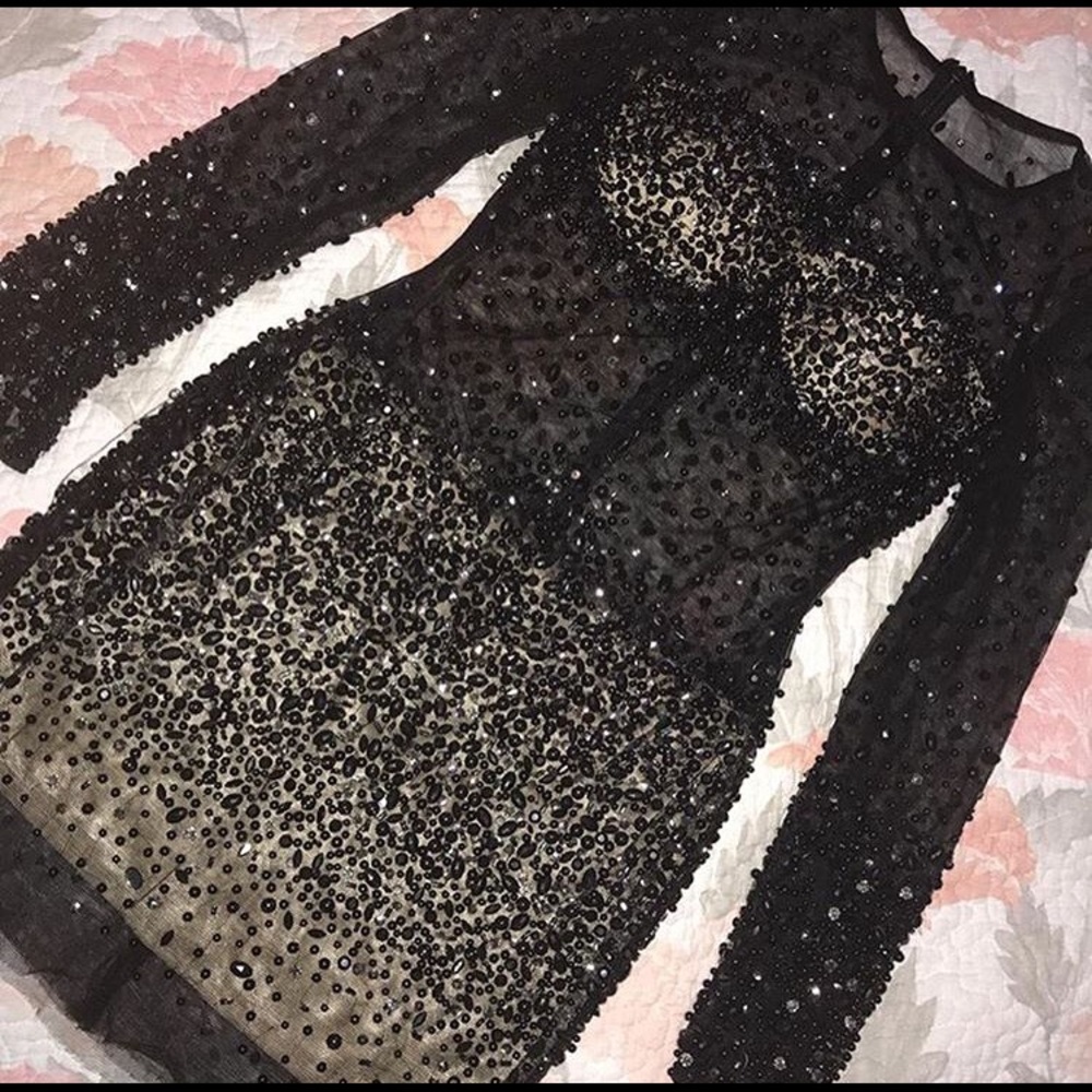 Black long sleeves sequin dress.